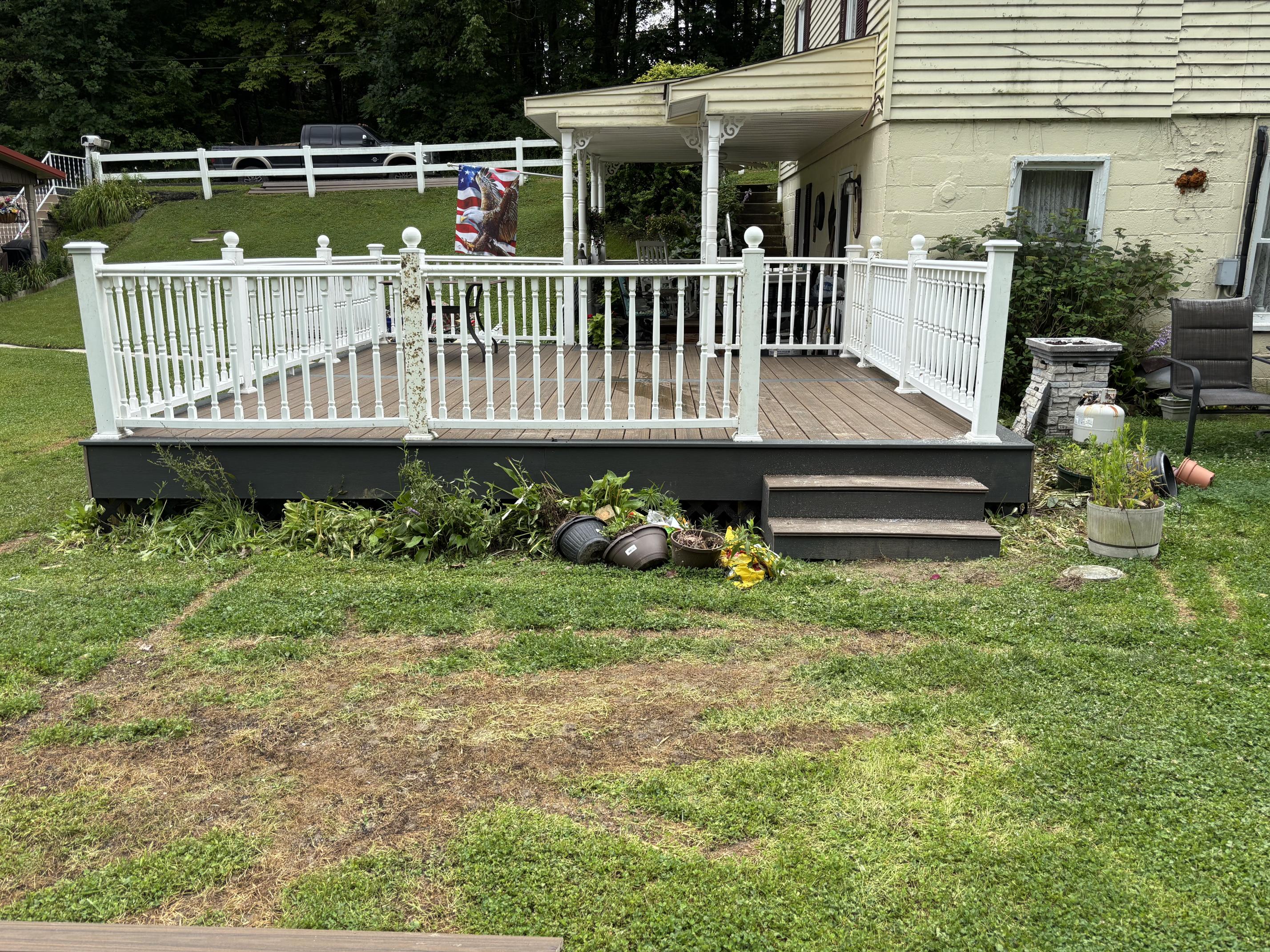 Completed deck installation with white railing in Harrison County, WV